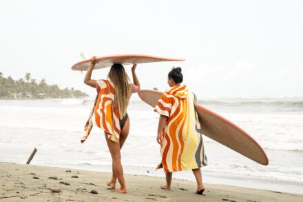 textured waves, slow tide, women of color in the surfing world, surfer girl, African American women, black women, surfer girls, surf poncho